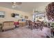 Outdoor lanai with ceiling fans and a table surrounded by wooden chairs at 115 Los Arbor Dr, Deland, FL 32724
