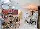 Open concept kitchen features bar seating, a dining area, and natural light from a skylight at 1156 Rivercrest Ct, Port Orange, FL 32128