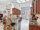 Gourmet kitchen boasts rich wood cabinets, granite countertops, and a large island with bar seating at 1156 Rivercrest Ct, Port Orange, FL 32128