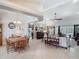 Open-concept living space with dining area, kitchen, and living room for entertaining at 1156 Rivercrest Ct, Port Orange, FL 32128