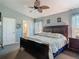 Cozy main bedroom with a large bed, soft colors, and an ensuite bathroom at 1156 Rivercrest Ct, Port Orange, FL 32128