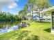 A beautiful backyard view featuring a serene pond and well-maintained landscaping at 116 Duck Hawk Cir # 3040, Daytona Beach, FL 32119