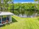 Enjoy the screened-in porch, with serene pond views in this tranquil backyard setting at 116 Duck Hawk Cir # 3040, Daytona Beach, FL 32119