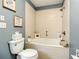 Bathroom featuring a soaking tub with decorative artwork at 116 Duck Hawk Cir # 3040, Daytona Beach, FL 32119