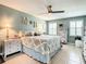 Bedroom with light green walls, ceiling fan, decorative wall art and accessories at 116 Duck Hawk Cir # 3040, Daytona Beach, FL 32119