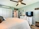 Spacious primary bedroom with a dresser, mirrored accent, and closet at 116 Duck Hawk Cir # 3040, Daytona Beach, FL 32119
