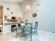 Open-concept dining and kitchen area, decorated with lovely accents and modern lighting fixtures at 116 Duck Hawk Cir # 3040, Daytona Beach, FL 32119