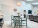 Charming dining area with a round table, stylish chairs, a unique chandelier, and lots of natural light at 116 Duck Hawk Cir # 3040, Daytona Beach, FL 32119