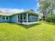 Home exterior showing the screened-in porch with water view at 116 Duck Hawk Cir # 3040, Daytona Beach, FL 32119