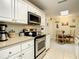 Modern kitchen with stainless steel appliances and a breakfast nook at 116 Duck Hawk Cir # 3040, Daytona Beach, FL 32119