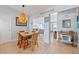 Cozy dining area with rattan furnishings, seamlessly connecting to the living spaces at 13 Essex Dr, Ormond Beach, FL 32176