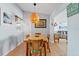 Bright dining room features a woven chandelier, bamboo table and chairs, and coastal-themed decor at 13 Essex Dr, Ormond Beach, FL 32176