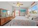 Bright main bedroom with ceiling fan, dual windows and nautical decor at 13 Essex Dr, Ormond Beach, FL 32176