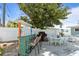 Backyard patio with outdoor kitchen, dining table, and privacy fence at 13 Essex Dr, Ormond Beach, FL 32176