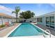 Relaxing backyard featuring a sparkling swimming pool, lounge chairs, and inviting patio at 13 Essex Dr, Ormond Beach, FL 32176