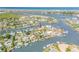 Aerial view of a beautiful home in a waterfront community with access to the bay and ocean at 133 Via Capri, New Smyrna Beach, FL 32169