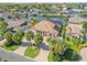Beautiful waterfront home with a brick driveway, lush landscaping, and gorgeous canal views at 133 Via Capri, New Smyrna Beach, FL 32169