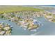 Aerial view of a beautiful home in a waterfront community with access to the bay and ocean at 133 Via Capri, New Smyrna Beach, FL 32169