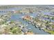 Stunning aerial view of a waterfront community with a house at the center at 133 Via Capri, New Smyrna Beach, FL 32169