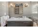 Modern bathroom featuring a vanity with undermount sink, sleek lighting, and minimalist decor, offering a spa-like experience at 133 Via Capri, New Smyrna Beach, FL 32169