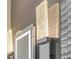 Sleek bathroom lighting fixture featuring a mirrored frame and textured glass accents at 133 Via Capri, New Smyrna Beach, FL 32169