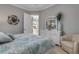 Cozy bedroom showcases a bed, dresser, and soothing decor, creating a relaxing and inviting space at 133 Via Capri, New Smyrna Beach, FL 32169