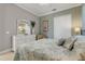 This bedroom is complete with a bed, dresser with mirror, and a closet, showcasing comfort and functionality at 133 Via Capri, New Smyrna Beach, FL 32169