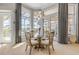 Inviting dining room with backyard access and decorative lighting at 133 Via Capri, New Smyrna Beach, FL 32169