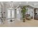 A grand foyer with high ceilings, a plant, and a decorative glass front door at 133 Via Capri, New Smyrna Beach, FL 32169