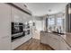 Sleek white cabinetry and gourmet appliances enhance this modern kitchen space at 133 Via Capri, New Smyrna Beach, FL 32169