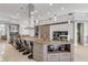 Open kitchen with island, modern hood, bar seating, and high-end appliances at 133 Via Capri, New Smyrna Beach, FL 32169