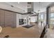 Modern kitchen featuring stainless steel appliances, sleek cabinetry, and a large center island with bar seating at 133 Via Capri, New Smyrna Beach, FL 32169