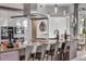 Modern kitchen featuring sleek countertops, stainless steel appliances, a large island, and pendant lighting at 133 Via Capri, New Smyrna Beach, FL 32169