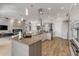 Spacious kitchen features an island and stainless appliances with open concept design at 133 Via Capri, New Smyrna Beach, FL 32169