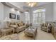Charming living room featuring comfortable seating, natural light, and elegant decor at 133 Via Capri, New Smyrna Beach, FL 32169