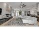 Open concept living room with modern decor and seamless transition into the kitchen area at 133 Via Capri, New Smyrna Beach, FL 32169