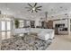 Open concept living room featuring modern decor, neutral color palette, and seamless transition into the kitchen area at 133 Via Capri, New Smyrna Beach, FL 32169