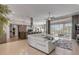 Spacious living room with ample natural light, modern furnishings, and access to outdoor living area at 133 Via Capri, New Smyrna Beach, FL 32169