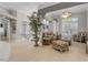 Cozy living room with bright light, neutral tones, and comfortable seating at 133 Via Capri, New Smyrna Beach, FL 32169