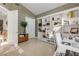 Bright office space boasts custom built-in shelving, neutral paint, and a workstation ideal for productivity at 133 Via Capri, New Smyrna Beach, FL 32169