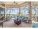 Serene outdoor living area with a view of the pool, canal, and comfortable seating arrangement at 133 Via Capri, New Smyrna Beach, FL 32169