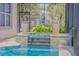 Pool with a relaxing hot tub, landscaped planters, and full screen enclosure provides for ultimate privacy at 133 Via Capri, New Smyrna Beach, FL 32169