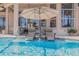 Relaxing pool with built-in seating and clear views of the surrounding patio at 133 Via Capri, New Smyrna Beach, FL 32169