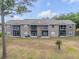 Drone view of multi-Gathering property highlighting screened lanais, well-maintained exteriors, and mature landscaping features at 160 Reserve Cir # 204, Oviedo, FL 32765