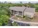 Aerial view of building with reserved parking, neat landscaping, surrounded by lush trees enhancing the property's appeal at 160 Reserve Cir # 204, Oviedo, FL 32765