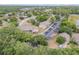 Community aerial view showcasing lush greenery, buildings, parking, and the surrounding landscape at 160 Reserve Cir # 204, Oviedo, FL 32765