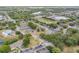 Aerial image of the community showcasing the pool, tennis courts, and lush landscaping at 160 Reserve Cir # 204, Oviedo, FL 32765