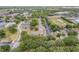 Scenic aerial view of the community featuring lush trees, buildings, parking areas, and recreational areas at 160 Reserve Cir # 204, Oviedo, FL 32765