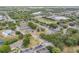 Aerial image of building with tennis courts and pool in a lush, landscaped community at 160 Reserve Cir # 204, Oviedo, FL 32765