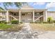 Inviting condo building features a manicured lawn and exterior stairs to the second-floor units at 160 Reserve Cir # 204, Oviedo, FL 32765